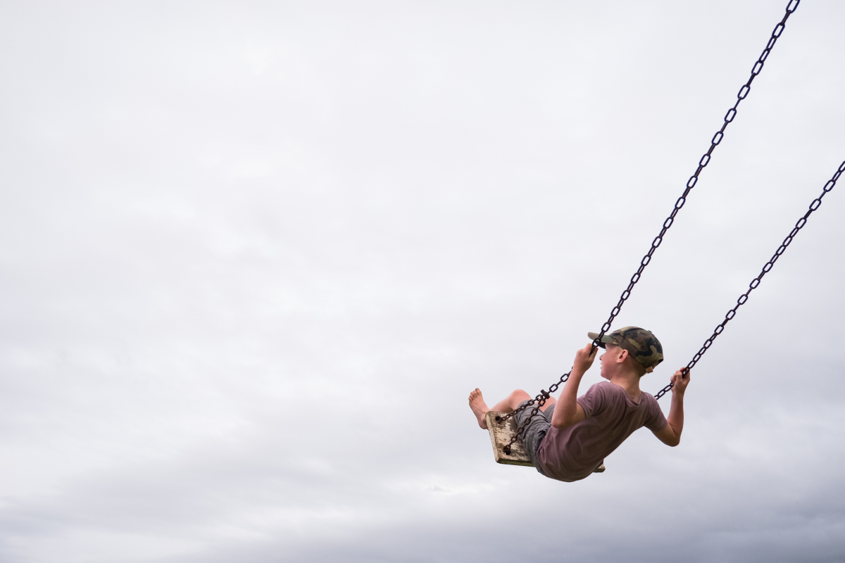 Young boy in a swing